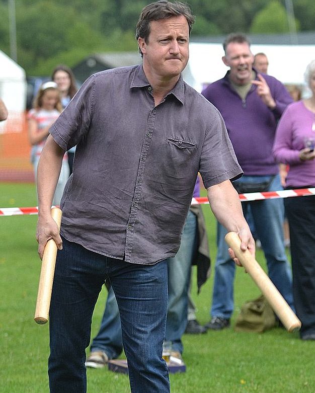 Prime Minister David Cameron has a go at Aunt Sally at the first world championships held at the Charlbury Beer Festival. 